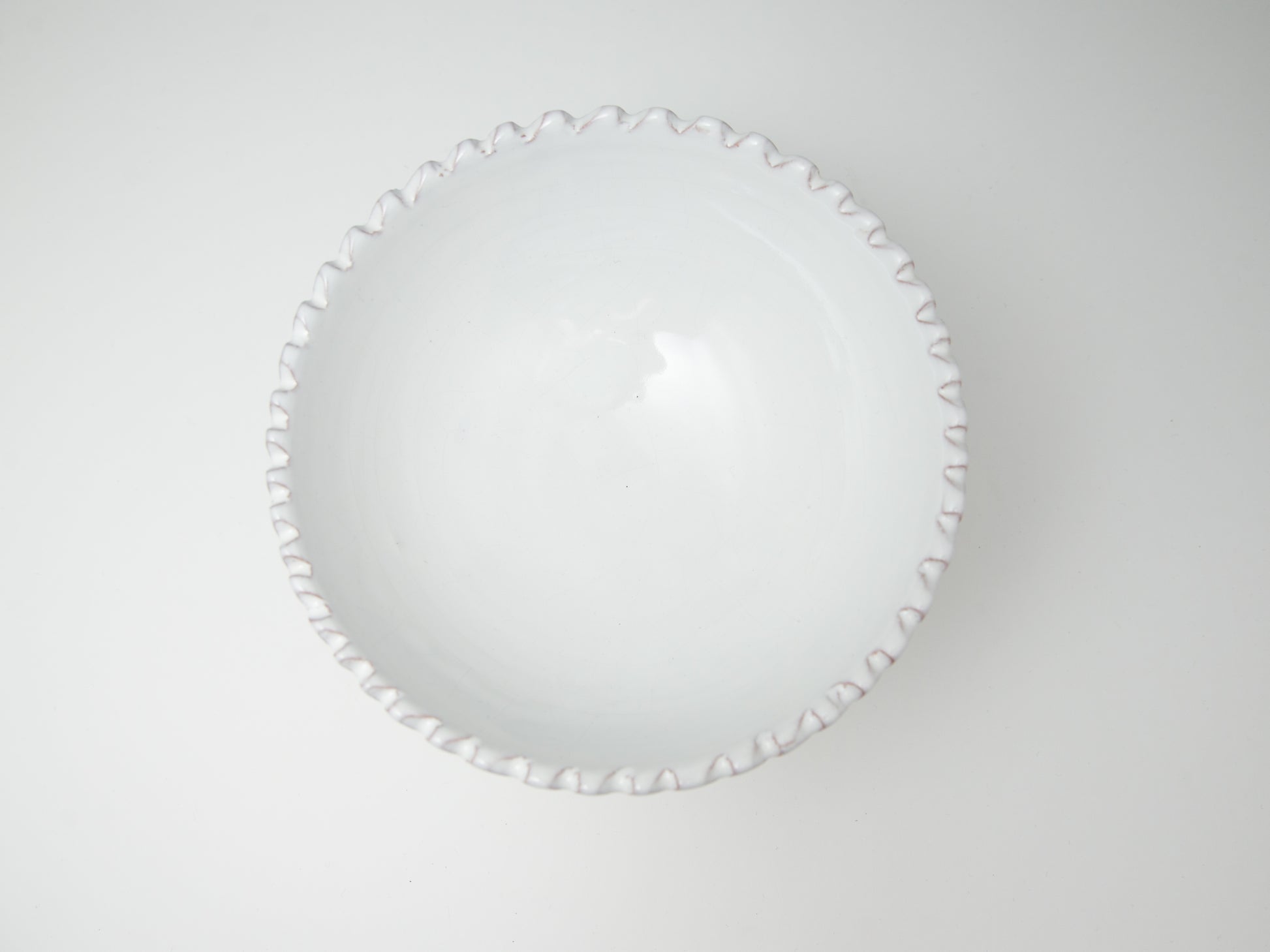 Coupe à bord dentelé